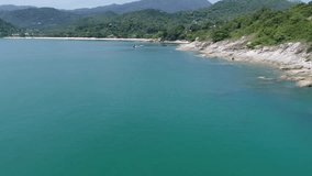 Drone footage. Thailand. Koh Phangan island. Top view aerial video. A motor boat sails in the sea. Beauty nature landscape on Thailand. Drone video. 4k.