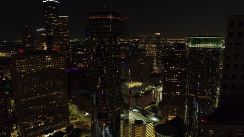 HOUSTON, TEXAS, USA - AUGUST 1, 2018: Aerial night drone footage of Downtown Houston Texas city lights