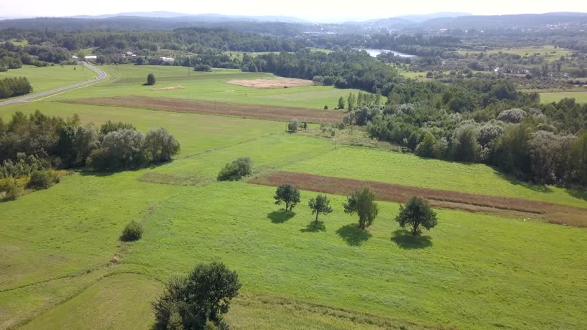Beautiful aerial shot of green hills and valleys. Nature of Bieszczady Mountains seen from above.