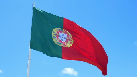 Isolate flag of Portugal on a flagpole fluttering