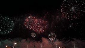 Amazing fireworks in 4K. New Year celebration colorful fireworks. New year and holidays concept.