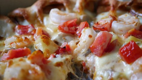 close up pizza cheese with shrimp and tomato topping