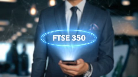 Businessman With Mobile Phone Opens Hologram HUD Interface and Touches Word - FTSE 350