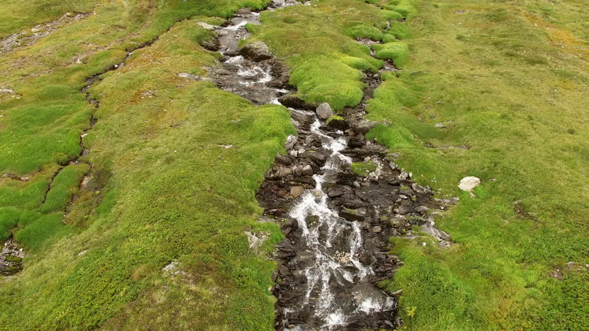 mountain river droneshot on 2064mtr. above sealevel. Andermatt Oberalppass, Switzerland