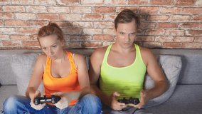 emotional Man And Woman Play Joysticks in The Console, they compete and make crazy funny faces. 4k, slow motion