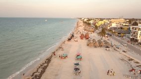 Panoramic aerial video with drone over the the beach with people in vacation