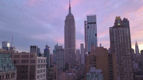 dawn flying backward view of Empire State Building