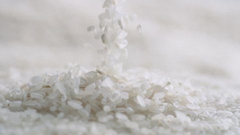Throwing rice over pile of rice. Shot with high speed camera, 4K. Slow Motion.