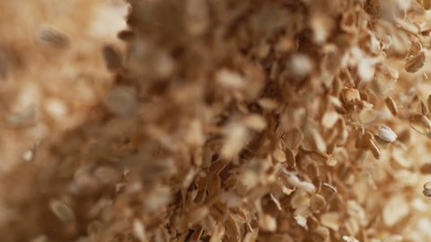 Throwing dried oats. Shot with high speed camera, 4K. Slow Motion.