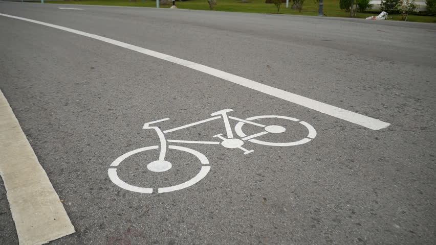 Bicycle signs on the bicycle way in the park | Shutterstock HD Video #1015538062