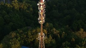 Aerial view on telecommunication  tower of cell phone antenna. Shoot from drone. 