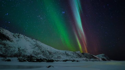 Northern Lights, polar light or Aurora Borealis in the night sky over the Lofoten islands in Northern Norway.