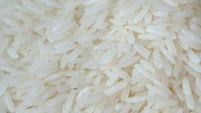 Motion video of close up raw rice / uncook rice. 