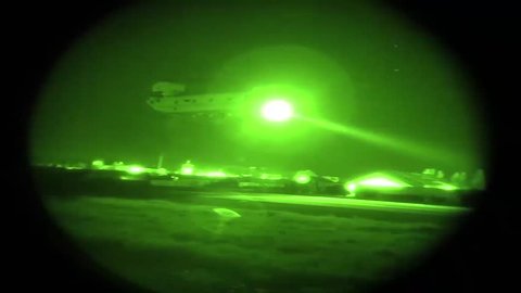 North Carolina, The United States - August 12, 2018: Night vision of multi mission aircraft flying over military base