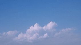 Time-lapse photography daytime sky with fluffy clouds video loop, exotic time, beautiful rolling cloudscape horizon, panorama. FHD.