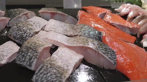 Assortment Of Raw Fish On Display In Market.
