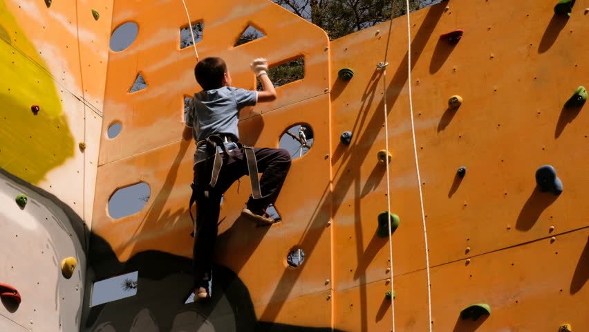 Free climber boy climbing On Practical Wall | Shutterstock HD Video #1015580848