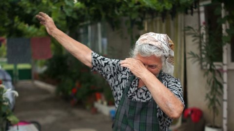 Grandmother shows a fashionable youth movement dab. Modern dance, sense of humor