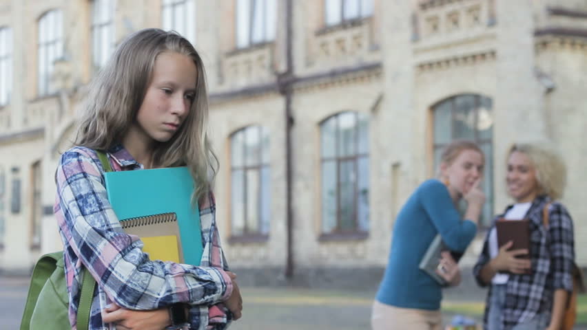 Beautiful modest girl teen having low self-esteem, arrogant classmates laughing | Shutterstock HD Video #1015584751