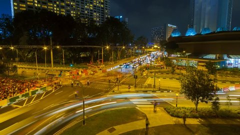 Raffles Street, Singapore - August 2018 - Timelapse of Singapore's traffic and pedestrian crossing the Raffles Street junction in a clear night after National Day Parade celebration.