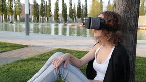 Young modern woman in VR glasses.