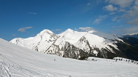 Aerial view from ski lift to ski piste and Pirin mountain range with highest summit Vihren in Bansko, Bulgaria