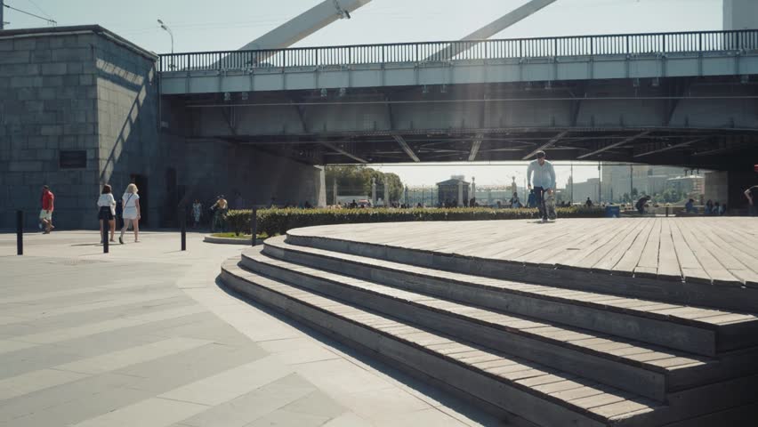 Skateboarder doing a kickflip down set of stairs, skater ollie over gap 360 flip trick extreme