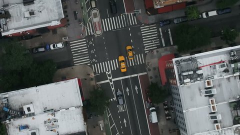 overhead aerial of taxis driving on street, cab in New York City NYC 1080 HD