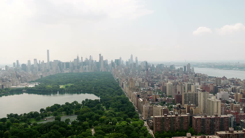 Central Park rising over green and buildings aerial New York City NYC 4K and 1080 HD