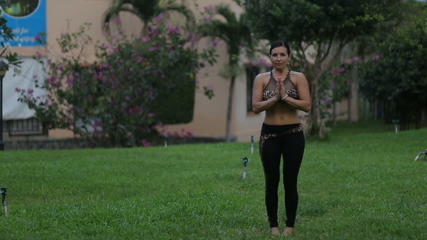 Beautiful woman yoga outdoors keep calm and meditates while practicing yoga to explore the inner peace. Yoga and meditation