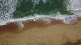 Aerial shot of surfers. Stunning waves of the Atlantic Ocean in France