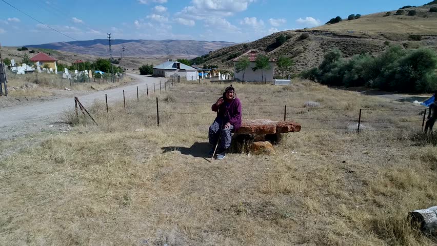 Village cemetery.
Old woman shaking hand.
Aerial photography.
Sivas city in türkiye.
Türkiye local dress.