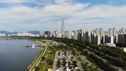 Aerial view cityscape of Seoul, South Korea. Aerial View Lotte tower at Jamsil. View of Seoul with river and mountain. Seoul downtown city skyline, Aerial view of Seoul, South Korea, 08/20/2018
