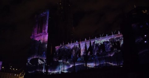 STRASBOURG, FRANCE - CIRCA 2018: Strasbourg Notre-Dame Cathedral building projection on the facade mapping light show during annual light show