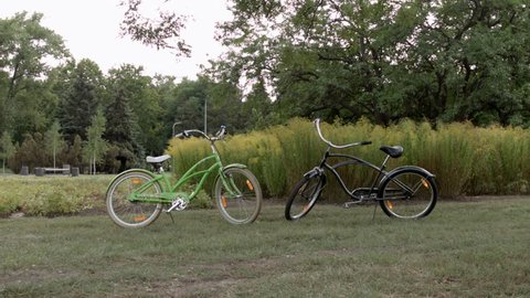 HD A shot of two bycicle standing nearby in the park