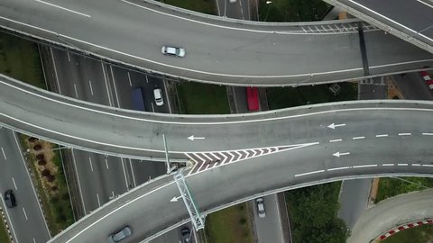 Aerial drone accent large road intersection highway from high altitude, Center of KL Kuala lumpur capital Malaysia development. Modern city traffic car move.