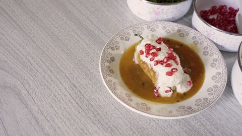 Chiles en nogada, traditional mexican dish from Puebla, Mexico. It consists of poblano chilis filled with picadillo topped with a walnut-based cream sauce, pomegranate and chopped parsley. 