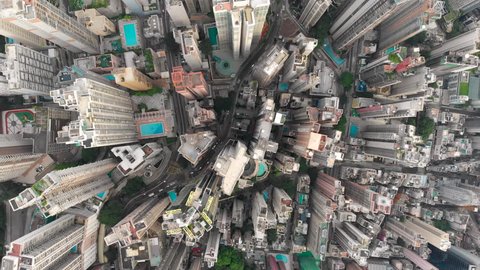 Aerial drone shot of congested building area of Hong Kong city and traffic