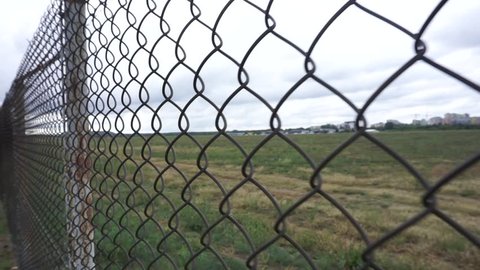 Poland, Warsaw, August 25, 2018: a metal fence made of wire around the airfield in Warsaw.