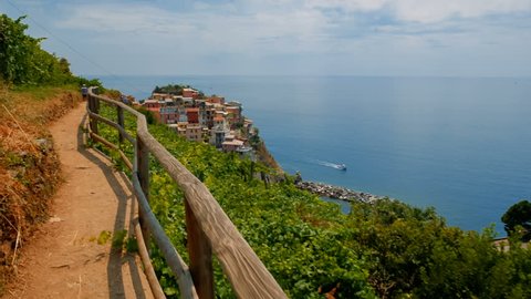 POV walk towards the village of Manarola in Cinque Terre, Liguria, Italy, a UNESCO World Heritage Site, famous for its coastline, five villages and surrounding hillsides