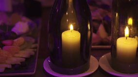 Close-up of golden candle in the bottle. Clip. Wedding decor
