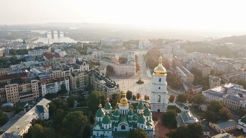 Saint Sophia's Cathedral, square. Kiev Kiyv Ukraine with Places of Interest. Aerial drone video footage. Sunrise light. City panarama. Summer time. Dnipro river and bridge. City center