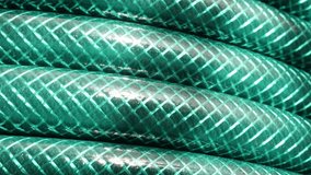 Brand new green hose 4K panning footage