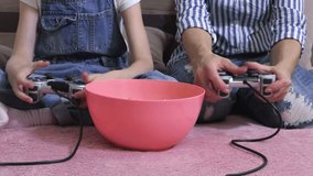 Hands using  gaming consoles