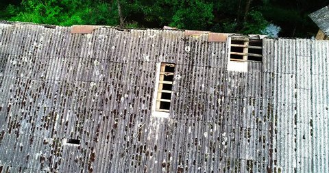 A roof with holes in an abandoned building