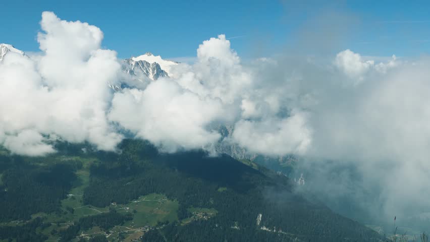 Large Fluffy Clouds in the Mountains of Switzerland