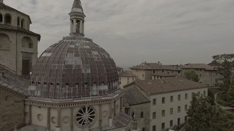 Aerial drone footage view OF Bergamo, historical buildings and towers  of Old city, in Italy // no video editing