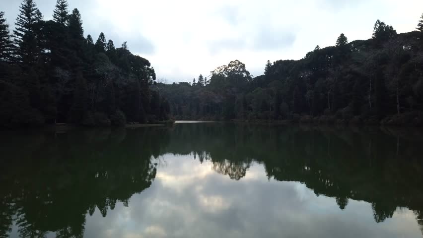 Lago Negro (Black Lake) between the forest, white swan and pirate ship pedal boat (pedalinho) - Gramado, Canela Rio Grande do Sul, Brazil - Aerial view