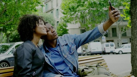 Young happy black couple outdoors: film stockowy