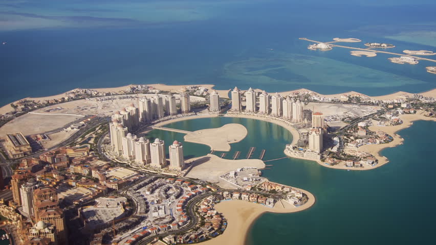 Passenger window view of Pearl Qatar. an artificial island. with its modern. highrise architecture. from a commercial airliner. FullHD footage Royalty-Free Stock Footage #1015763731